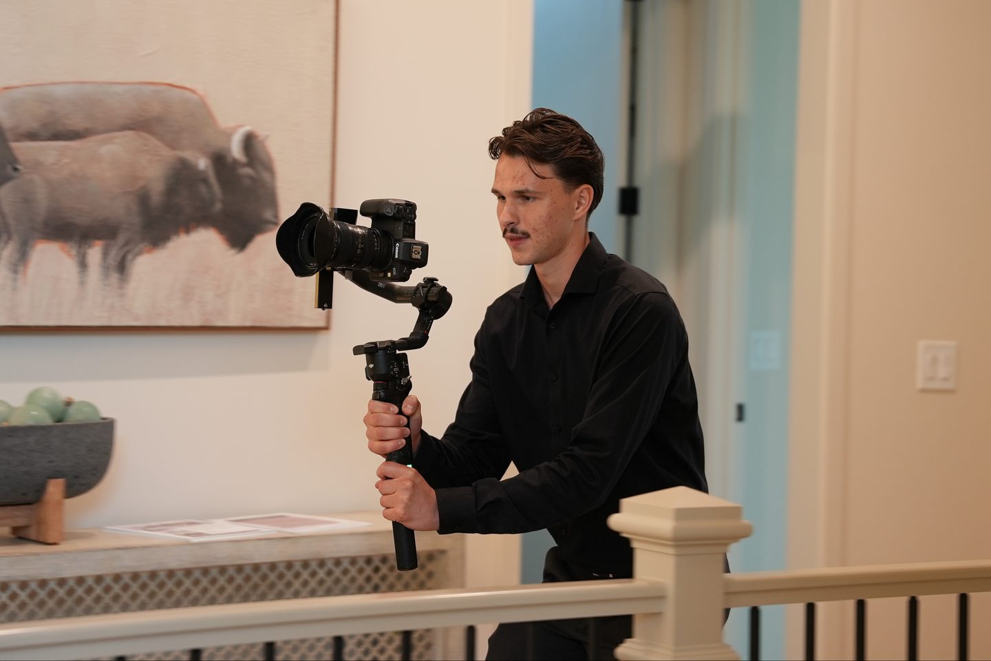 Sutter Media videographer filming a client home with a camera gimbal